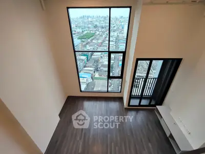 Spacious high-rise apartment with stunning city view and large windows