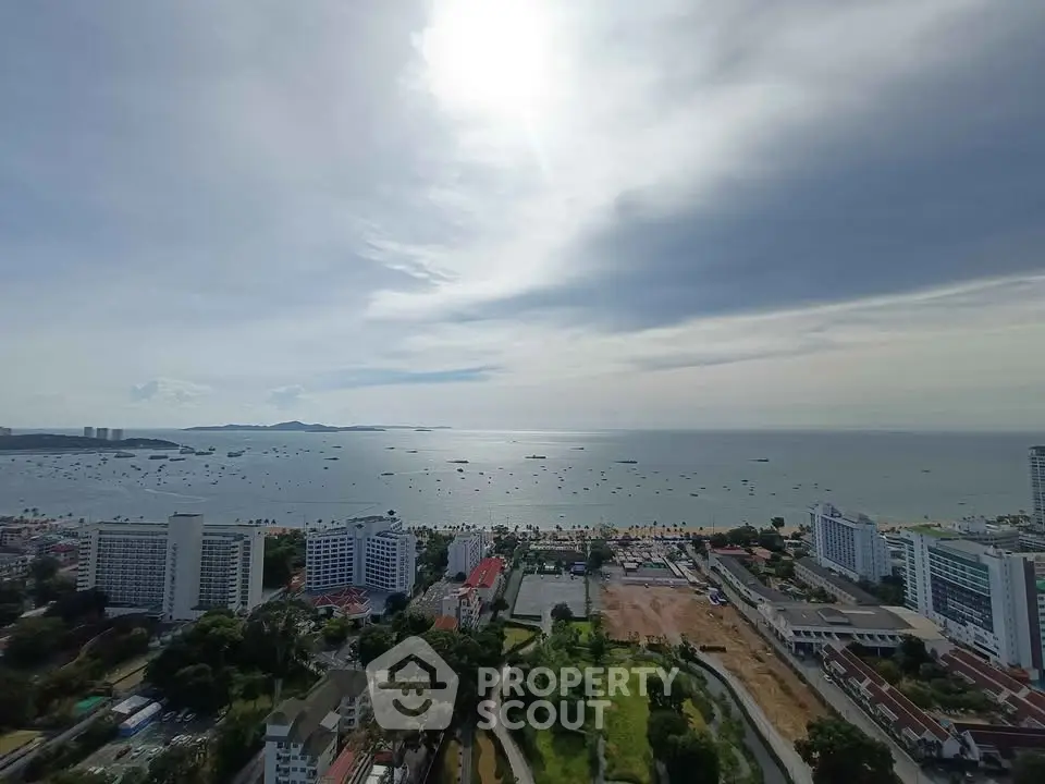 Stunning ocean view from high-rise building overlooking the coastline and cityscape.