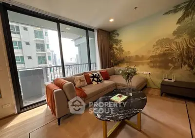 Stylish living room with large windows and modern decor in urban apartment.