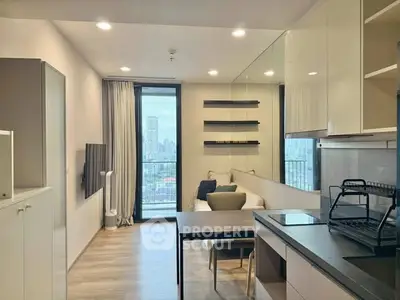 Modern open-plan living room with city view, sleek furniture, and stylish decor.