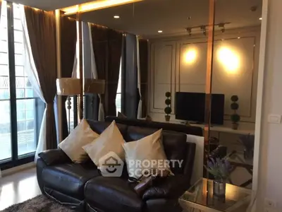 Luxurious living room with elegant decor and large windows offering ample natural light.