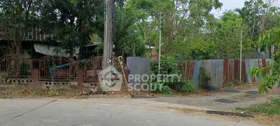 Charming rustic property with lush greenery and potential for renovation in a serene neighborhood.