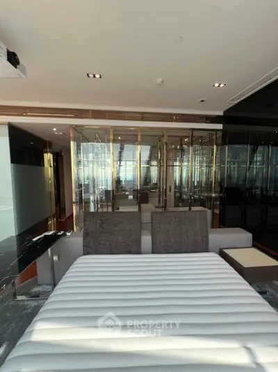 Luxurious modern bedroom with panoramic glass walls and sleek design