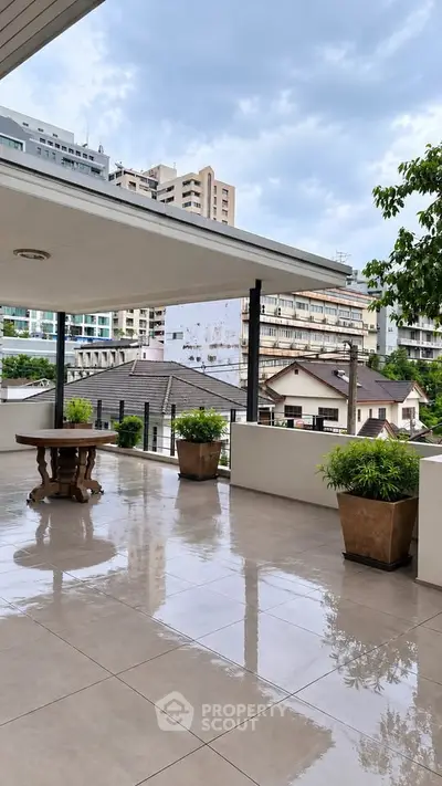 Spacious balcony with city view and modern design, perfect for relaxation and entertainment.