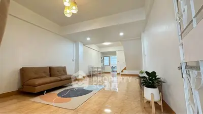 Spacious living room with modern decor and natural light