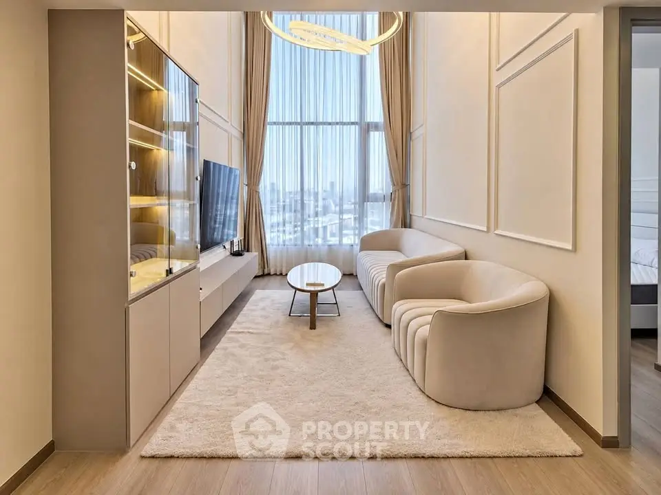 Luxurious modern living room with high ceilings and large windows offering stunning city views.