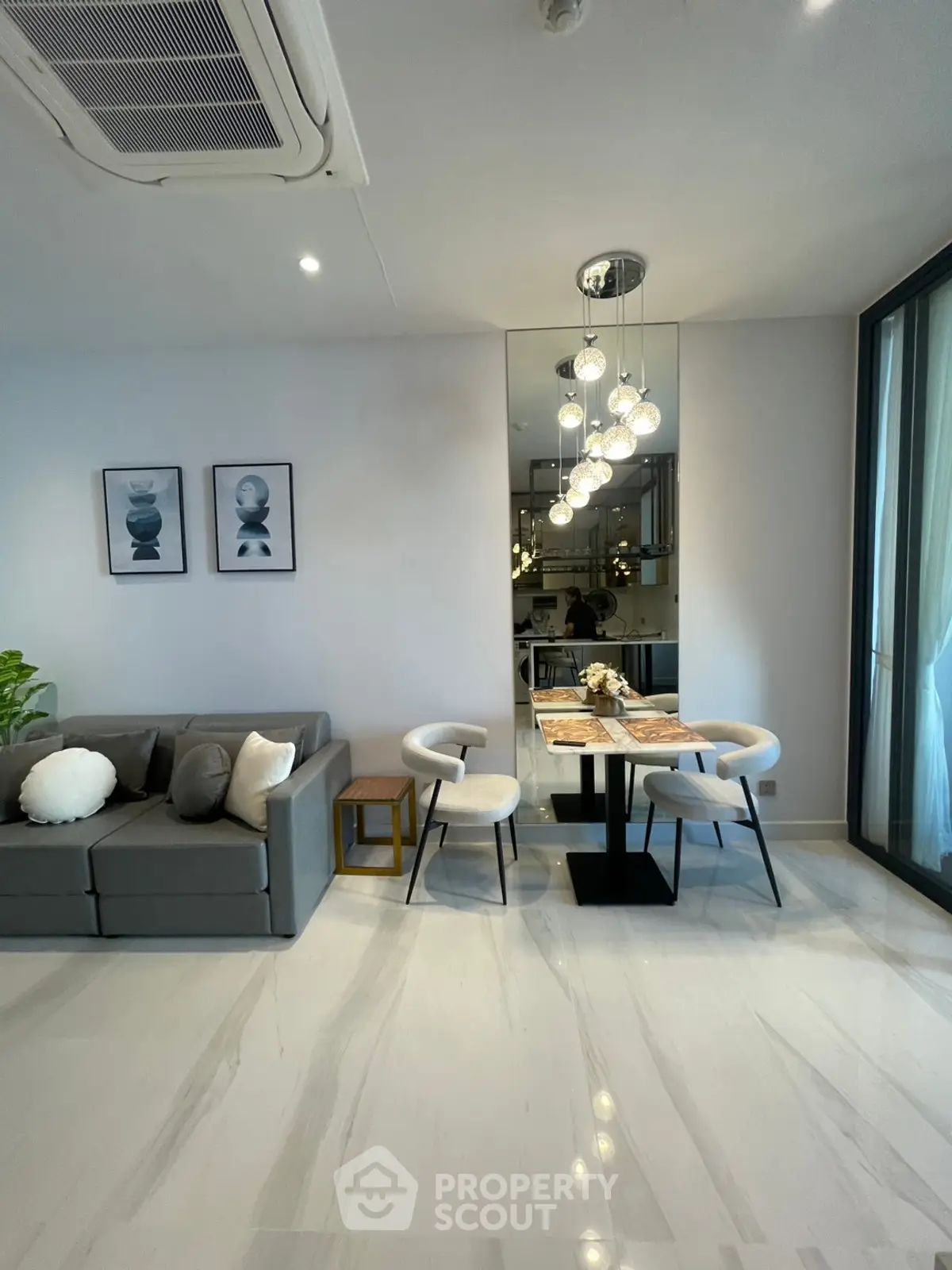 Modern living room with elegant dining area and stylish decor in a luxurious apartment.