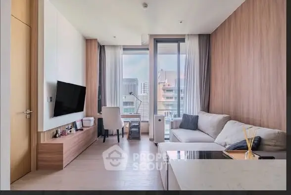 Modern living room with city view, stylish furniture, and natural light.