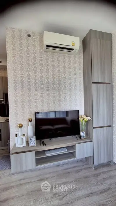 Modern living room with stylish TV unit and air conditioning