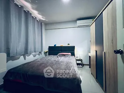 Cozy bedroom with modern furnishings and air conditioning