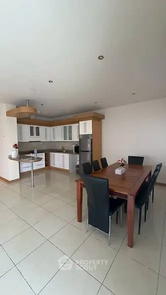 Spacious open-layout kitchen with dining area and modern appliances.