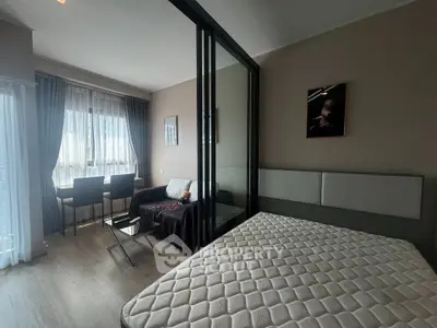 Modern studio apartment with glass partition and cozy furnishings