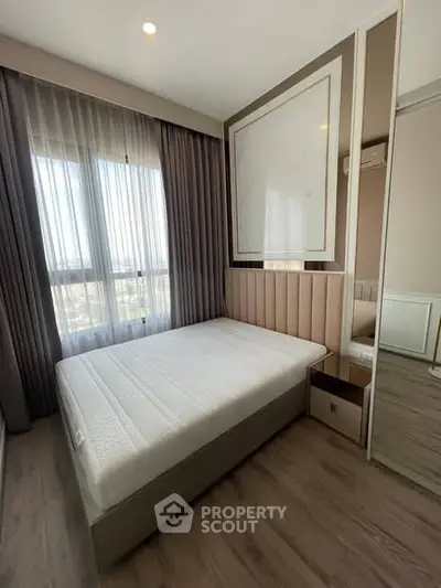 Modern bedroom with large window and stylish decor