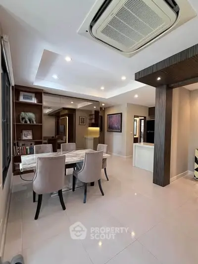 Spacious modern dining area with elegant furniture and open layout