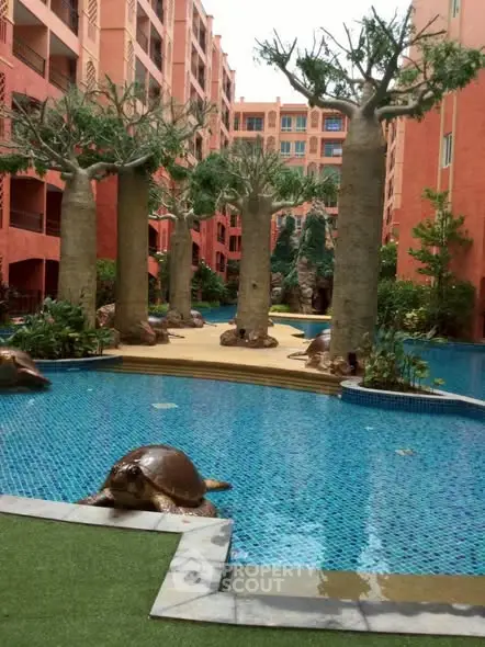 Stunning apartment complex with unique pool and artistic landscaping.