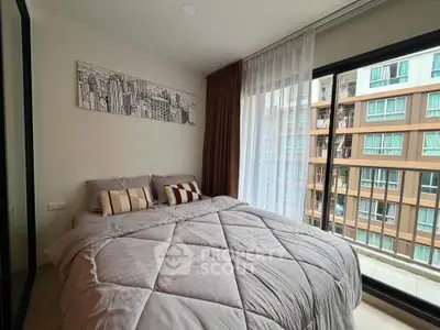 Modern bedroom with large window and city view in urban apartment