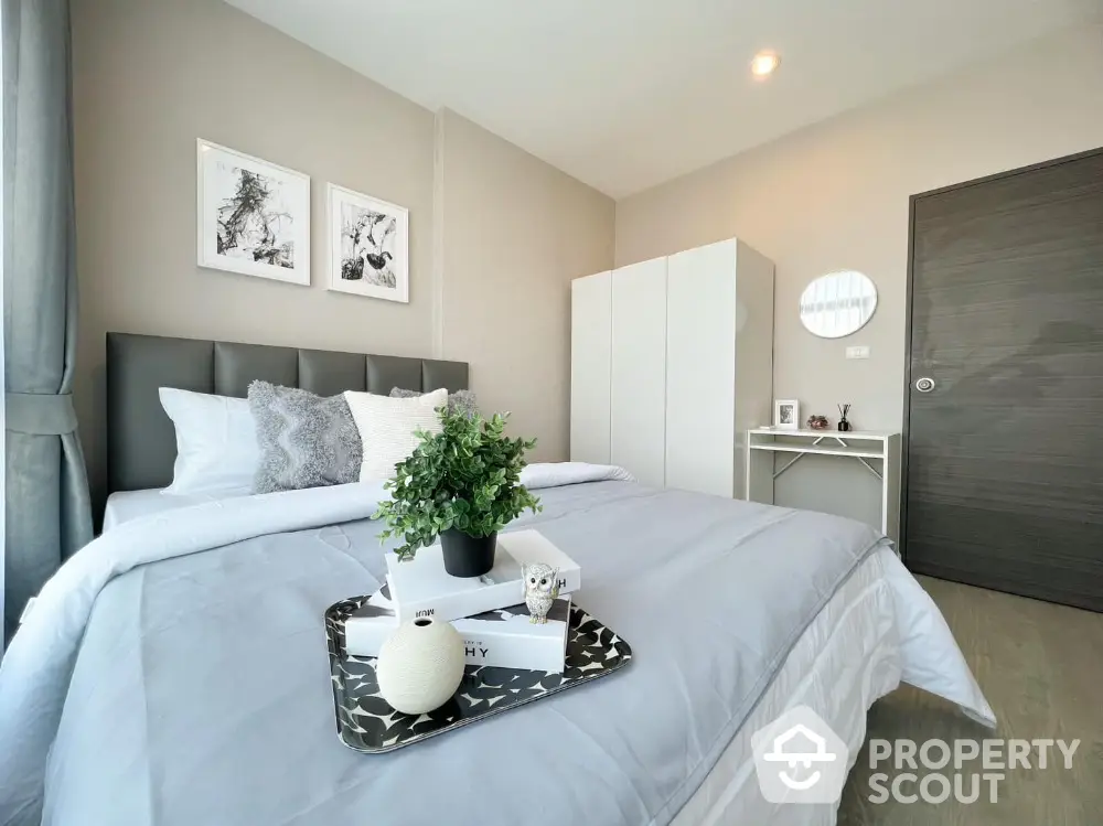 Modern bedroom with stylish decor and cozy ambiance in a contemporary apartment.