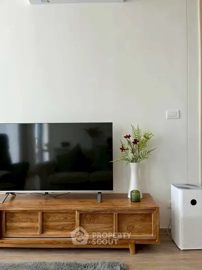 Modern living room with wooden TV stand and air purifier, stylish decor