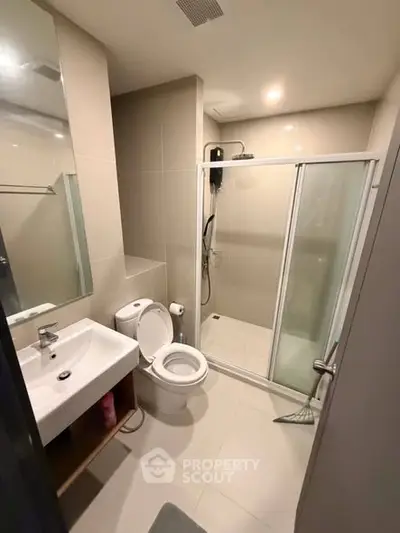 Modern bathroom with shower enclosure and sleek fixtures