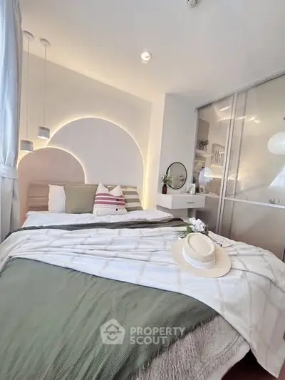 Chic modern bedroom with stylish decor and cozy ambiance, featuring elegant lighting and plush bedding.