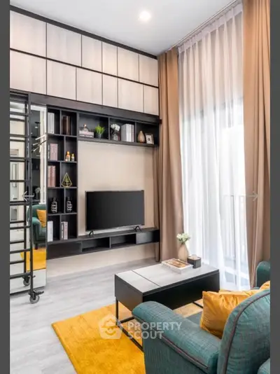 Modern living room with stylish decor and large windows for natural light.