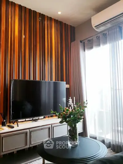 Modern living room with stylish wood paneling and large TV