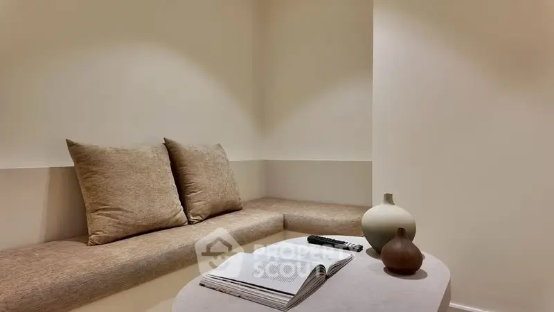 Cozy minimalist living area with neutral tones and modern decor