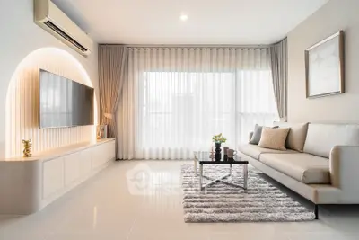 Modern living room with sleek design, large window, and stylish furniture, perfect for contemporary urban living.