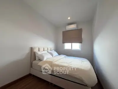 Cozy minimalist bedroom with natural light and modern decor