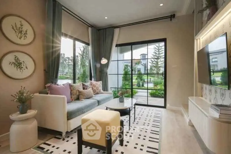 Charming living room with modern decor and garden view, perfect for relaxation.