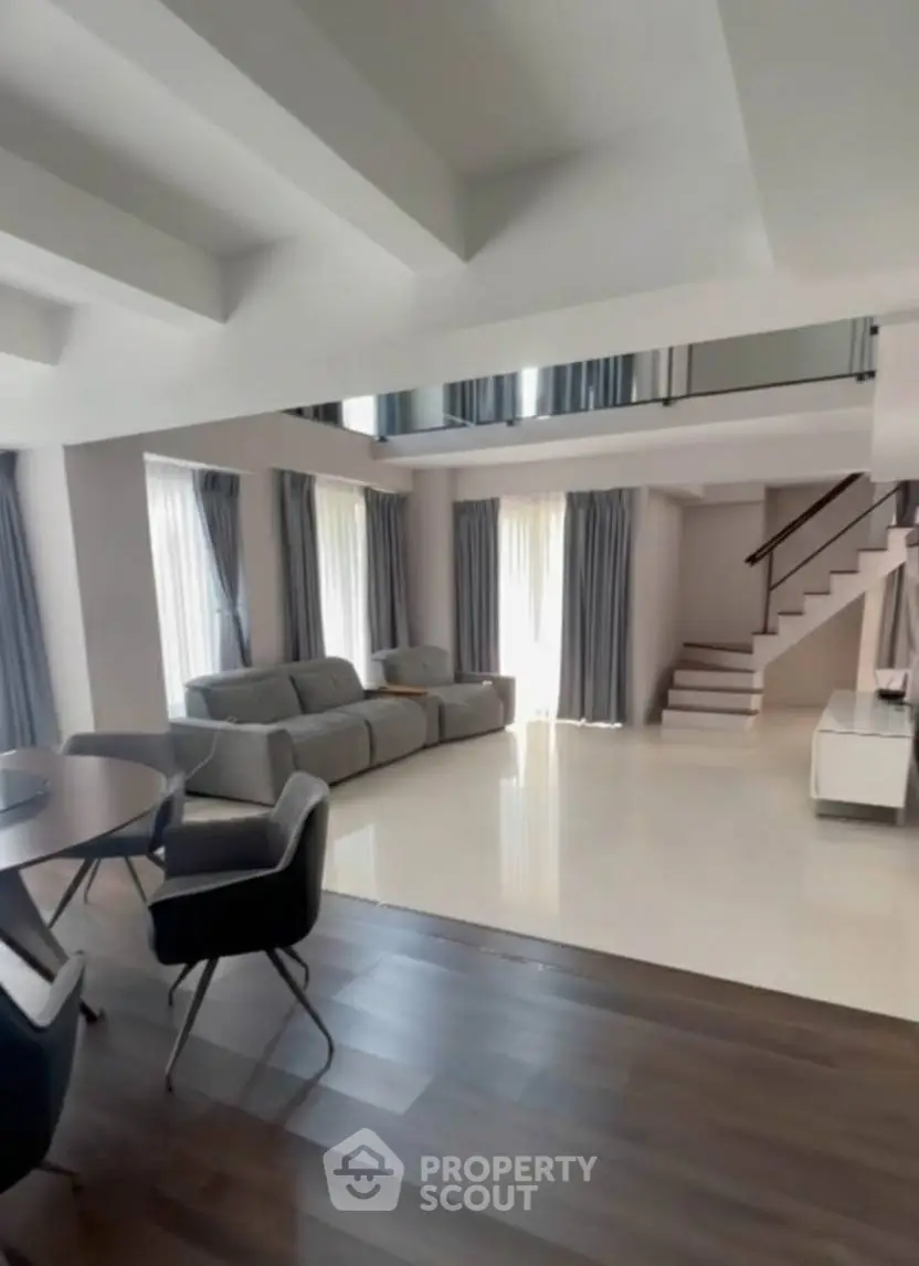 Spacious modern living room with elegant furniture and open layout