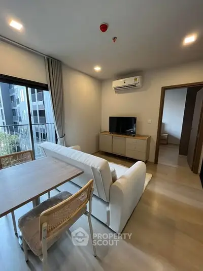 Modern living room with balcony view in stylish apartment