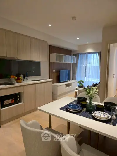 Modern open-plan living room with stylish kitchen and dining area