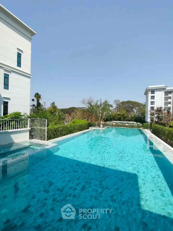 Luxurious residential pool with serene surroundings and modern architecture