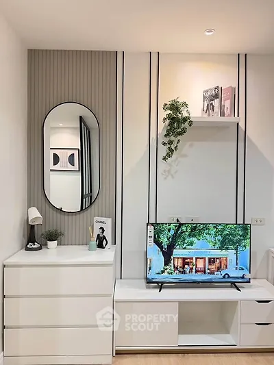 Modern living room with sleek white furniture and stylish decor