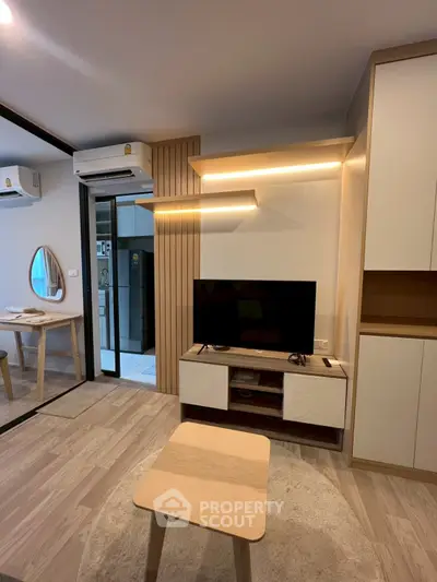 Modern living room with stylish furniture and ambient lighting in a cozy apartment.