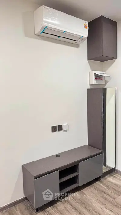 Modern interior with sleek cabinetry and air conditioning unit, perfect for contemporary living spaces.