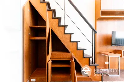 Modern interior with stylish under-stair storage and wooden accents