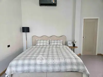 Modern bedroom with stylish decor and comfortable bedding