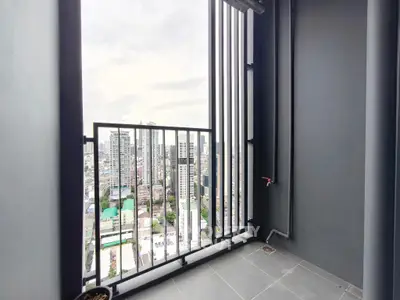 Modern balcony with city view in high-rise apartment