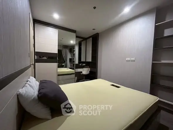 Modern bedroom with built-in wardrobe and sleek design