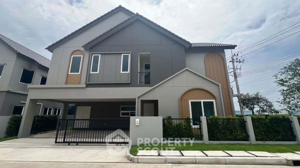 Modern two-story house with sleek design and spacious driveway