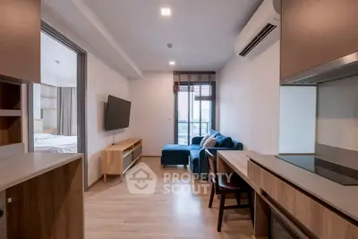 Modern living room with sleek furniture and open layout in a stylish apartment.