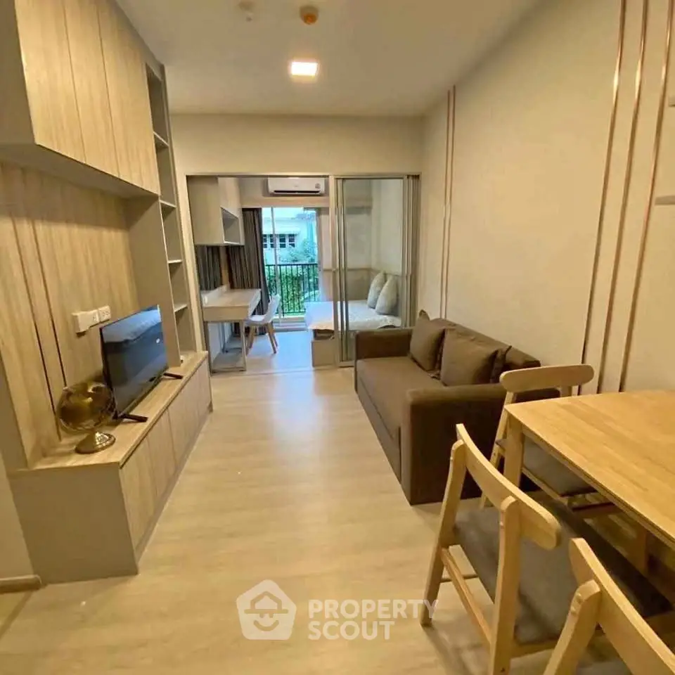 Modern apartment interior with cozy living room and dining area, featuring stylish furniture and natural light.