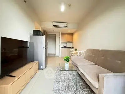 Modern living room with sleek furniture and open kitchen layout