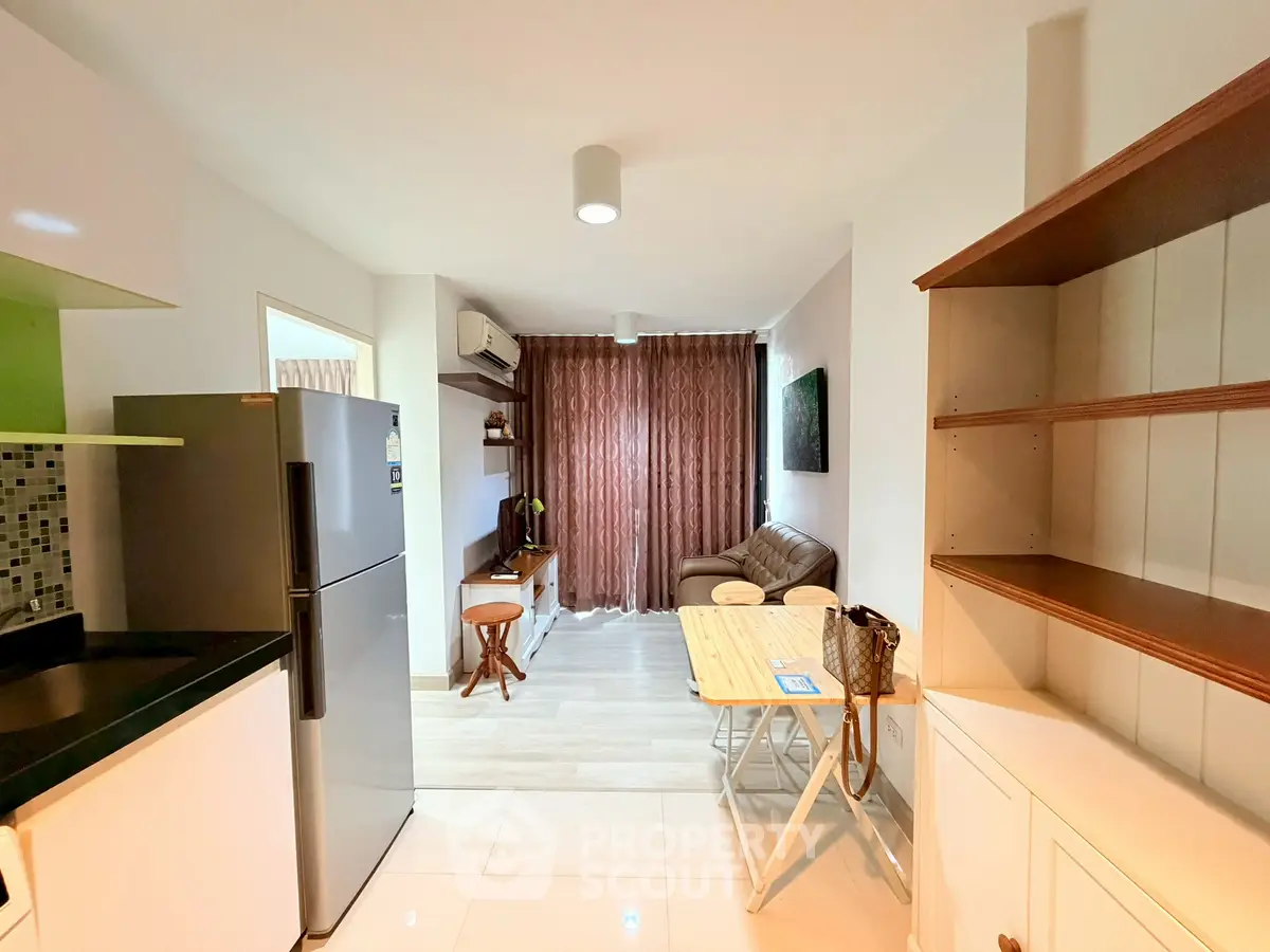 Cozy living room with modern furniture and natural light, perfect for relaxation and entertainment.