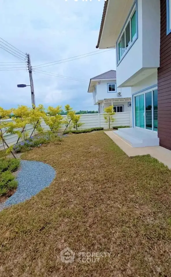 Charming suburban home with manicured lawn and modern exterior design, perfect for family living.