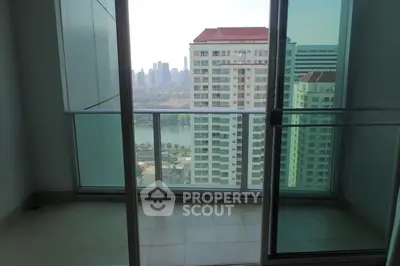 Spacious balcony with stunning cityscape view in modern high-rise apartment.