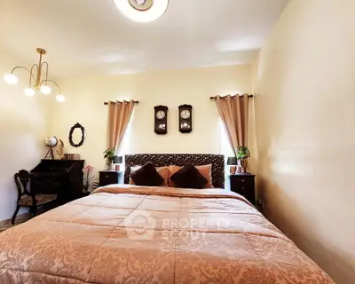 Cozy bedroom with elegant decor and warm lighting, perfect for relaxation.