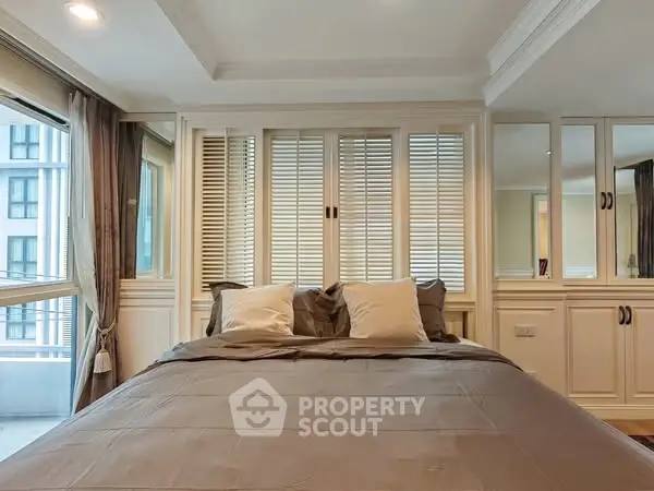 Luxurious bedroom with elegant decor and large windows in modern apartment